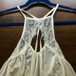 Lacy, open back, off-white top with key hole